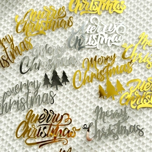 Golden and silver mirror acrylic Merry Christmas cake toppers with festive tree designs