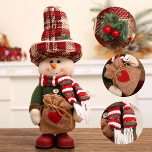 Standing Christmas snowman plush with tall plaid hat, scarf and burlap heart gift bag