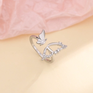 Close-up of S925 hallmark on silver butterfly ring with sparkling zircon stones