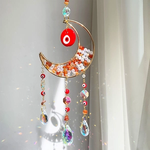 Golden moon crystal suncatcher with evil eye beads and orange healing stones