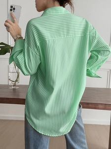 Detailed back view of women's green vertical striped long sleeve casual vacation shirt