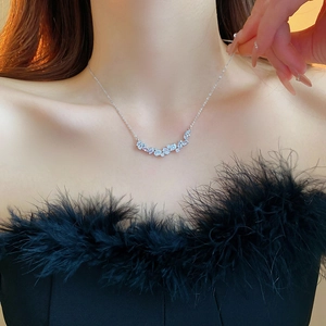 Minimalist silver chain necklace with shimmering water drop and round zircon clusters