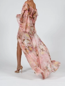 Detail of pink floral chiffon set featuring a flowy split maxi skirt and off-shoulder top