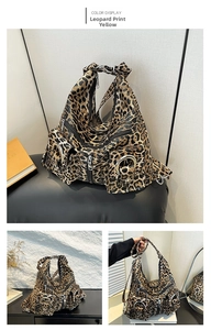Detailed view of yellow leopard print tote bag with multiple zippers and metallic rings