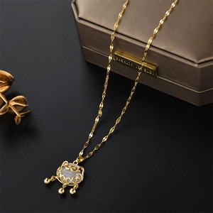 Golden auspicious cloud ruyi lock necklace with white jade and sparkling diamond accents