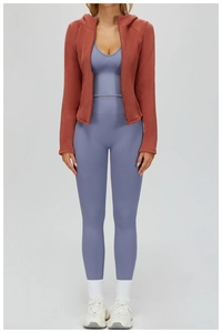 Three-piece women's sports set with hooded fleece jacket and purple yoga leggings