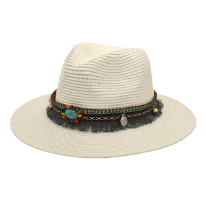 Detail of bohemian straw fedora hat featuring turquoise stone and colorful beadwork