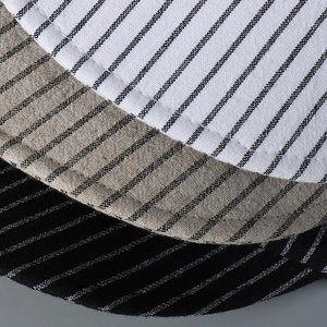 Detailed macro view of striped cotton-linen fabric texture with smooth stitched edges