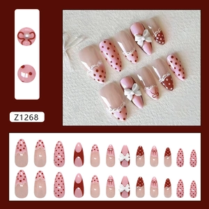 Unghie finte rosa ballerina con pois rossi pizzo e fiocchi 3D decorativi