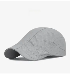 Detail view of laser-perforated grey sun cap showing breathable quick-dry mesh fabric