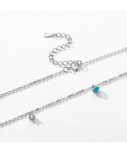 Detail of S925 sterling silver necklace with turquoise bead and zirconia pendant