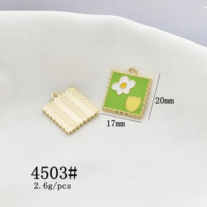 Detailed macro view of postage stamp alloy pendant with white daisy flowers 17mm x 20mm