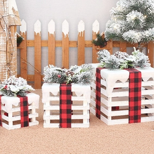 Three-piece wooden Christmas gift box set with buffalo plaid ribbons and snowy pine accents