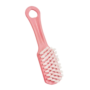 Pink plastic shoe cleaning brush with soft white bristles and hanging hole for storage
