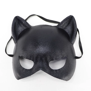 Macro shot of black cat-ear masquerade mask featuring a subtle glitter finish texture