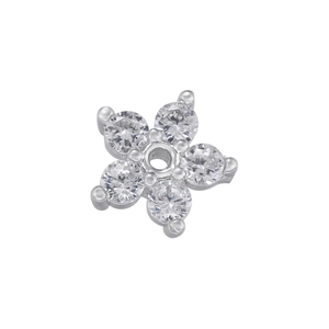 Macro shot of silver plated five-petal flower pendant base with cubic zirconia stones