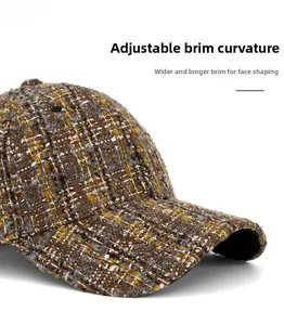 Detail of tweed baseball cap showing textured weave and wide curved brim for face framing