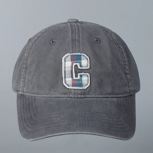 Close-up of the letter C embroidery with blue plaid pattern on grey cotton baseball cap