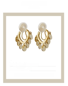 Detailed view of U-shaped clip-on earrings with gold sequins and 1.8cm size metrics
