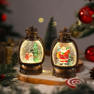 Close-up of vintage bronze Christmas lanterns featuring warm LED lights and Santa snow globe
