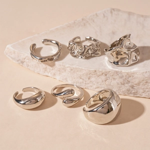 6-piece silver metallic ring set featuring crinkled geometric designs and lava texture