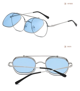 Detail view of silver flip-up sunglasses with blue lenses and 45-degree mechanical structure