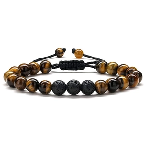 Detail of 8mm tiger eye and black lava stone beads on an adjustable braided cord bracelet