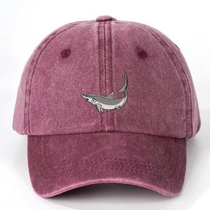 Vintage washed burgundy baseball cap featuring a detailed gray shark embroidery on the front