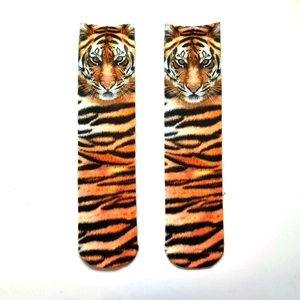 Detailed view of novelty socks featuring realistic orange tiger print and paw patterns