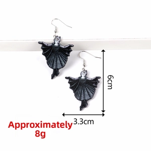 Detail of bat-winged ballerina earrings with dimensions 6cm x 3.3cm on a white stand