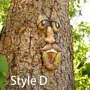 Luminous tree face garden decoration with glowing eyes and mossy bark texture