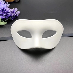 Classic white half-face masquerade mask with black elastic strap on dark background