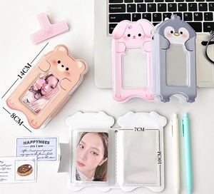 Close-up showing dimensions of cartoon animal photo card holder and storage sleeves