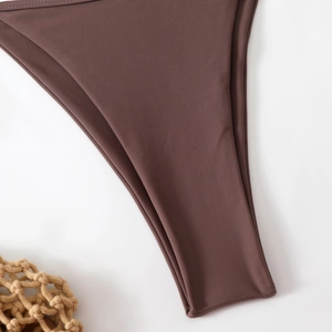 Close-up of chocolate brown bikini bottoms with high-stretch fabric and double stitching