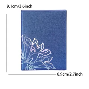 Blue textured rectangular jewelry gift box with iridescent floral design and dimensions