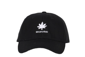 Detailed view of maple leaf and Goldparko embroidery on a black cotton baseball cap