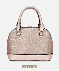 Back view of the champagne gold sequin shell bag showing its smooth metallic finish