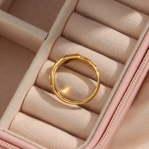 Close-up of 18K gold-plated irregular zircon ring in a pink velvet jewelry box