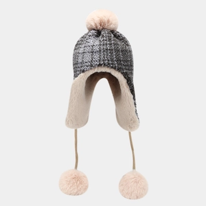 Winter trapper hat with gray knit, plush lining and pom-poms for cold weather