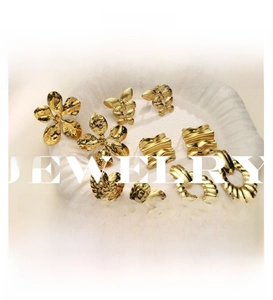 Close-up of geometric hammered texture on 18k gold plated stainless steel stud earrings