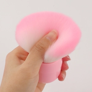 Pink mushroom head foundation brush with dense fibers for flawless makeup application