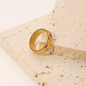 Fashionable gold titanium steel ring with star engraving and sparkling diamond inlay