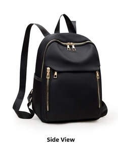 Detailed side view of black nylon backpack featuring golden metal zippers and top handle