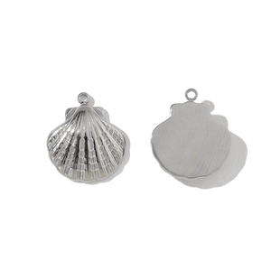 Detail of silver seashell pendant with textured front and smooth back for DIY jewelry