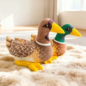 Realistic mallard duck plush toys sitting on a soft beige rug in a cozy home setting