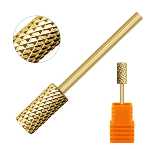 Macro view of golden cylindrical nail drill bit with cross-texture for professional manicure