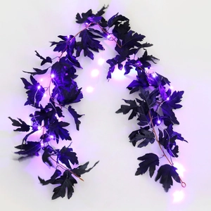 Detail of Halloween purple LED maple leaf string lights with realistic silk leaves