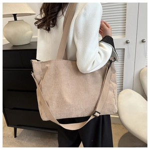 Minimalist beige corduroy tote bag for women showing crossbody strap and large capacity