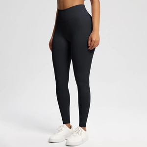 Close-up of seamless black high waist yoga pants showing elastic matte fabric and shape