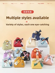 Detailed view of various colorful leather-textured wedding favor bags with ribbon bows
